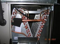 A/C coil is inspected